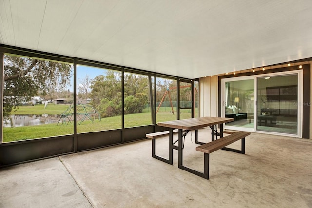 sunroom with a water view