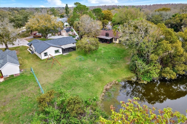 birds eye view of property with a water view