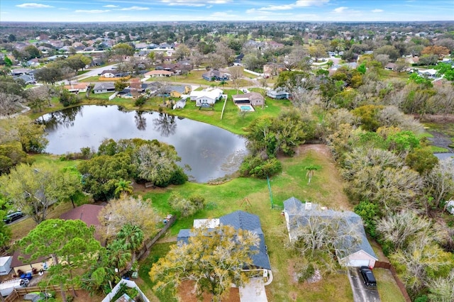 bird's eye view featuring a residential view and a water view