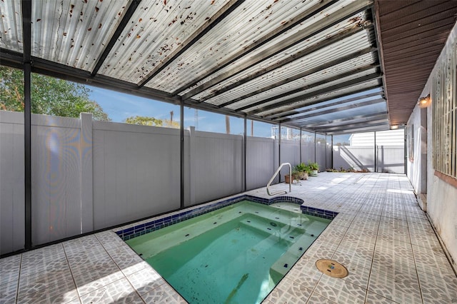 view of pool with a patio area, a fenced backyard, and an in ground hot tub