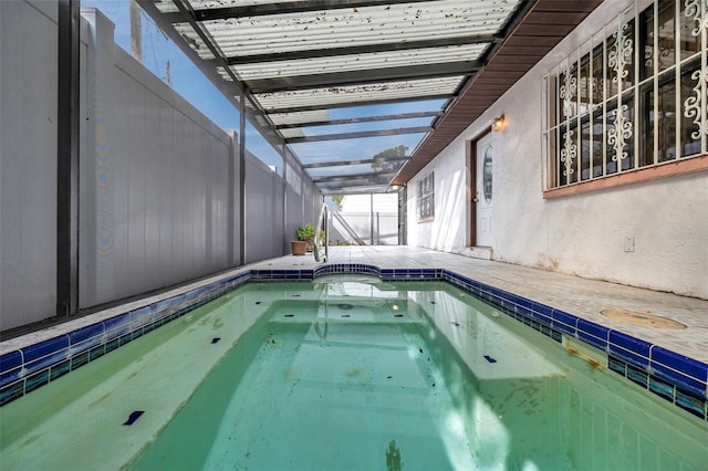 view of pool featuring a lanai