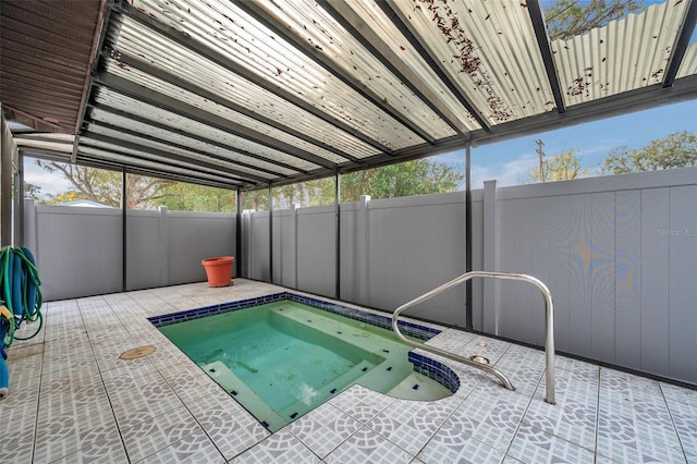 view of pool with a fenced backyard and a patio