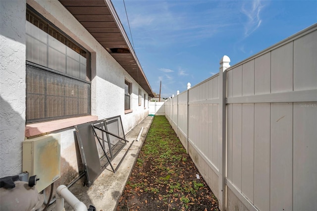 exterior space with fence and stucco siding