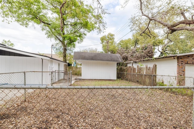 view of yard with an outdoor structure and fence