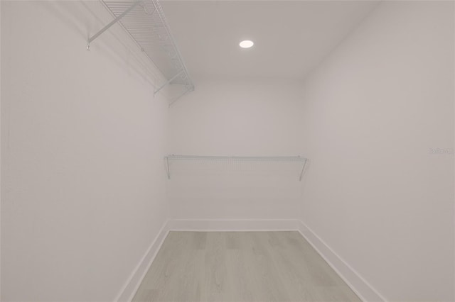 walk in closet featuring light wood-style floors