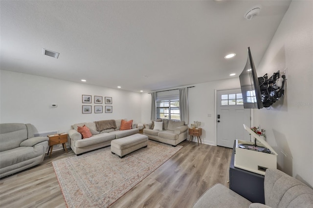 6333 Spanish Main Dr, Apollo Beach, FL 33572 - living area with light wood-style floors, recessed lighting, and visible vents