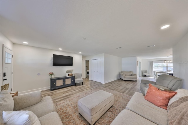 6333 Spanish Main Dr, Apollo Beach, FL 33572 - living area featuring light wood finished floors, baseboards, and recessed lighting