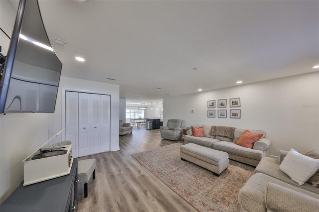 6333 Spanish Main Dr, Apollo Beach, FL 33572 - living room featuring light wood-type flooring and recessed lighting