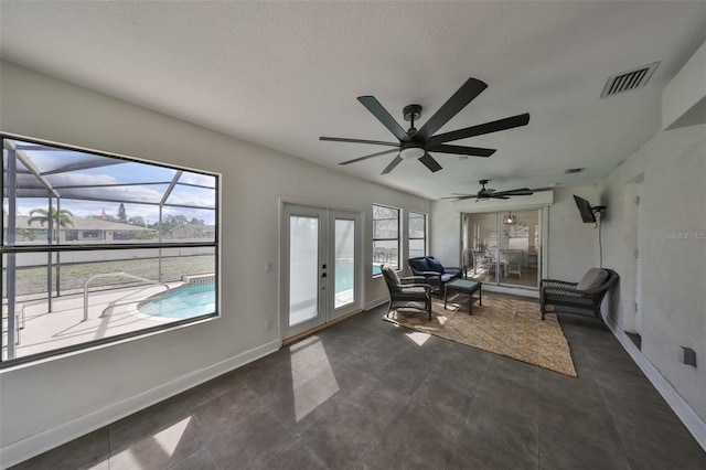 6333 Spanish Main Dr, Apollo Beach, FL 33572 - unfurnished room with a sunroom, french doors, visible vents, and baseboards