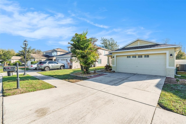 view of front of property with stucco siding, an attached garage, central AC unit, a front yard, and driveway