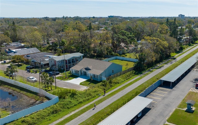 birds eye view of property with a water view and a forest view