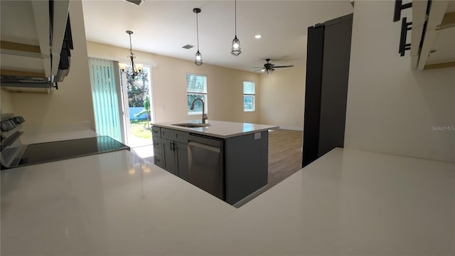 kitchen with ceiling fan, stove, decorative light fixtures, stainless steel dishwasher, and a sink