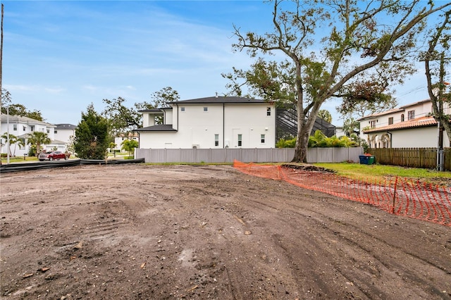 exterior space with fence and a residential view