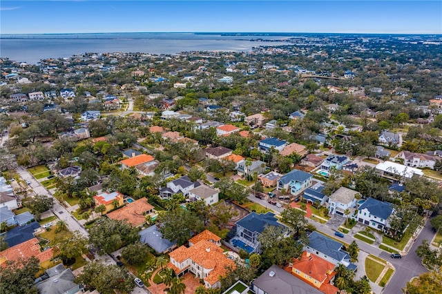 drone / aerial view with a residential view and a water view