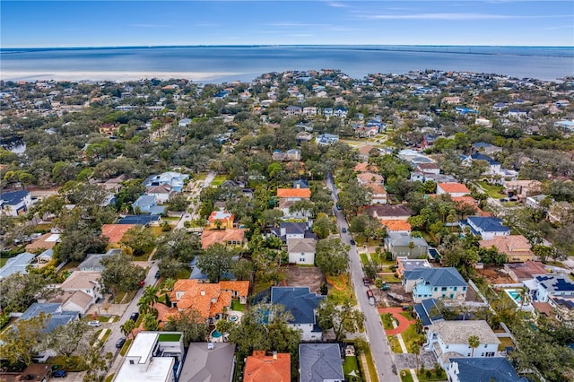 drone / aerial view featuring a residential view and a water view