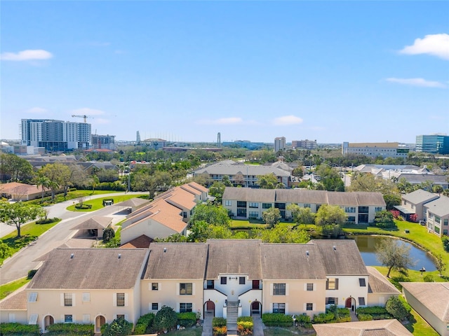 birds eye view of property with a water view and a residential view