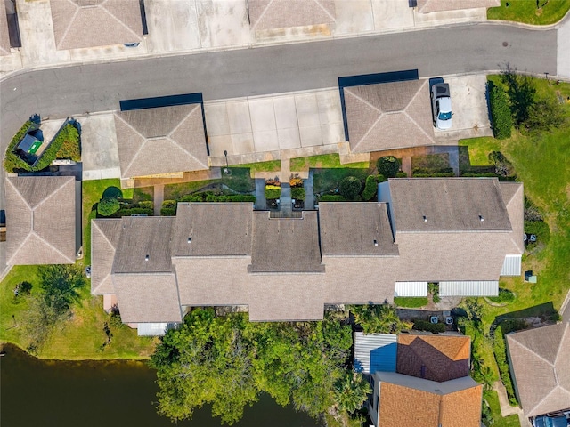 bird's eye view featuring a water view and a residential view