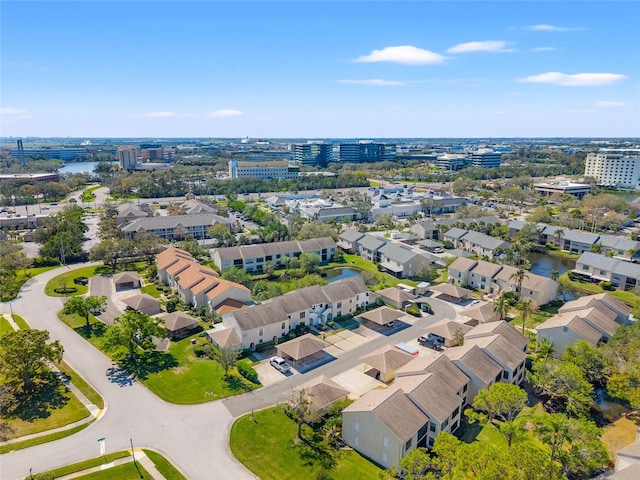 drone / aerial view featuring a water view and a residential view