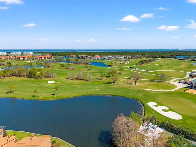 aerial view with a water view and view of golf course