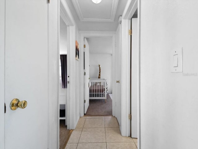 corridor featuring light tile patterned floors