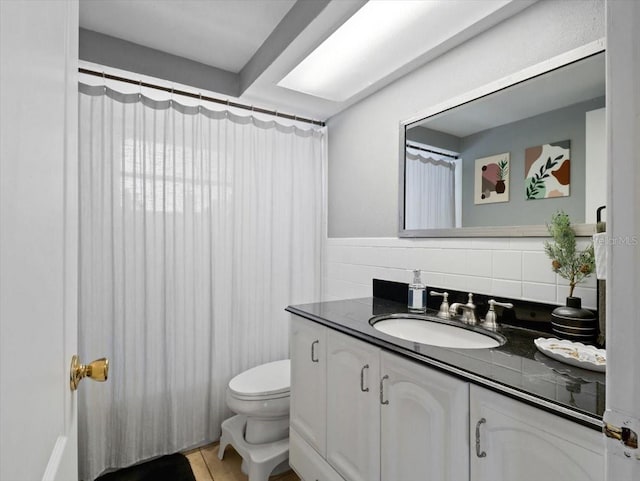 full bathroom with vanity and toilet