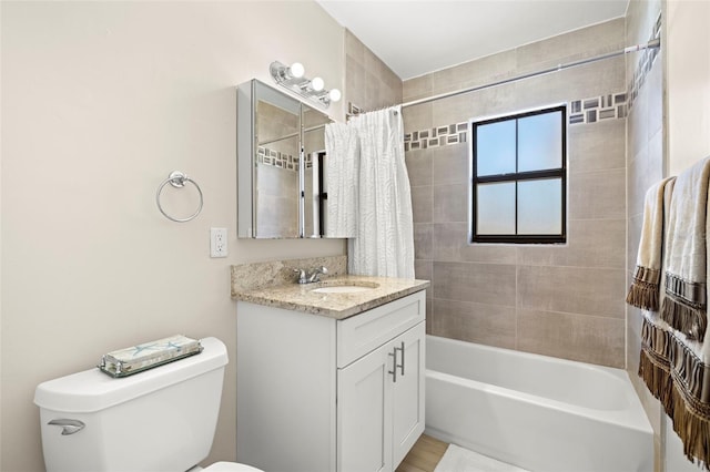 bathroom featuring toilet, shower / bath combo, and vanity