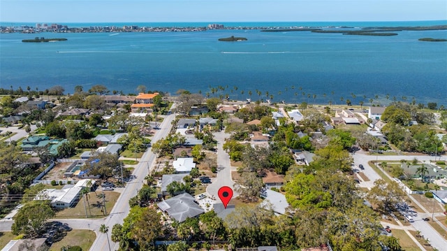 drone / aerial view featuring a residential view and a water view