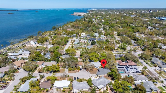 birds eye view of property with a water view and a residential view