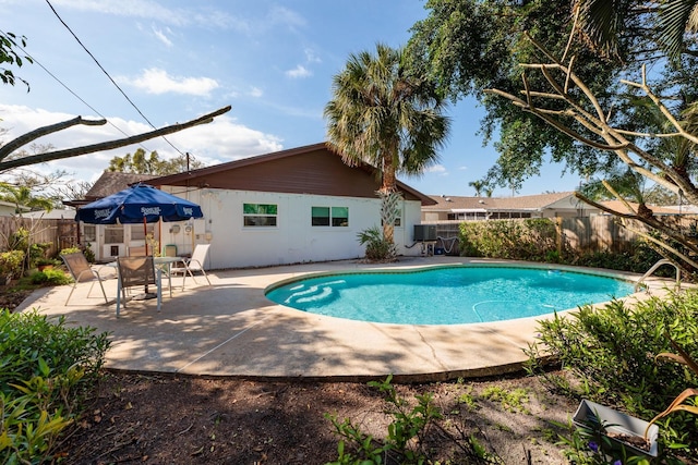 view of swimming pool with a patio area, a fenced backyard, and a fenced in pool