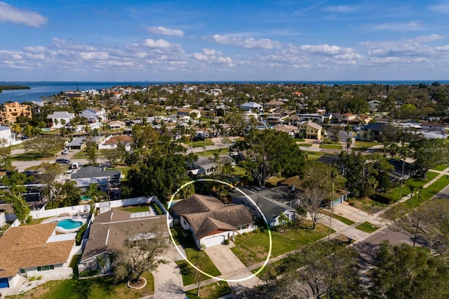 drone / aerial view featuring a water view and a residential view