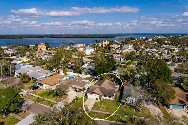 bird's eye view featuring a water view and a residential view