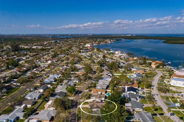 drone / aerial view featuring a water view and a residential view