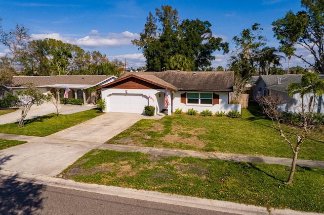 single story home featuring an attached garage, a front lawn, concrete driveway, and stucco siding