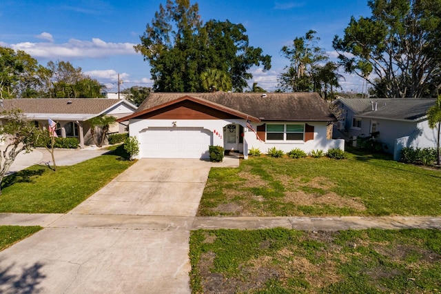 single story home featuring a garage, driveway, a front lawn, and stucco siding