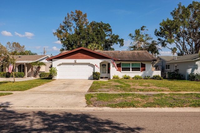 ranch-style home featuring a front yard, concrete driveway, an attached garage, and stucco siding