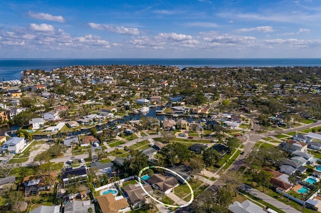 drone / aerial view featuring a water view and a residential view