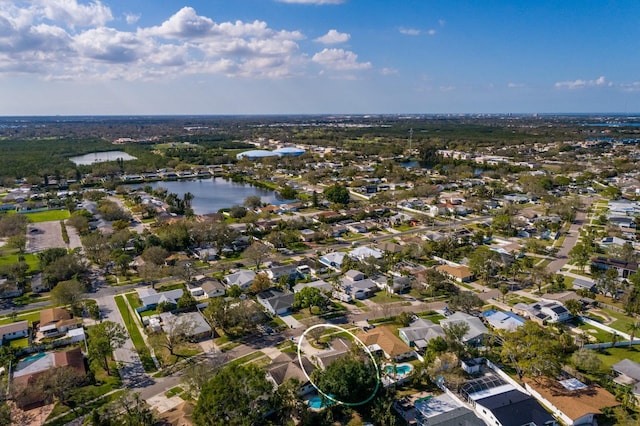 birds eye view of property featuring a residential view and a water view