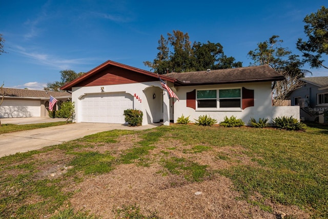 ranch-style home with a garage, driveway, a front yard, and stucco siding