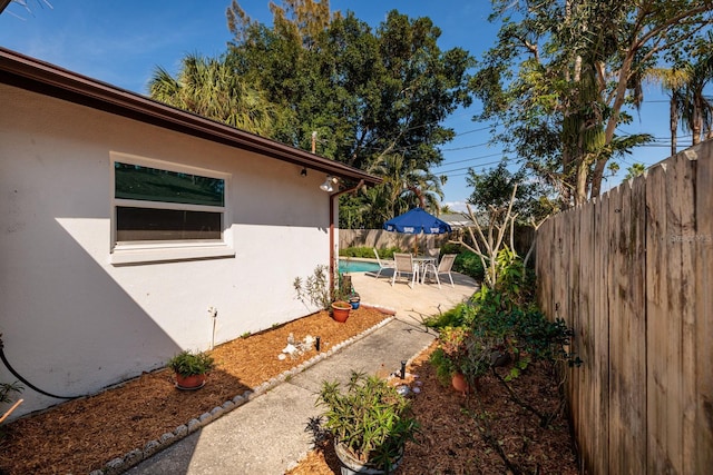 view of yard with a patio area and a fenced backyard