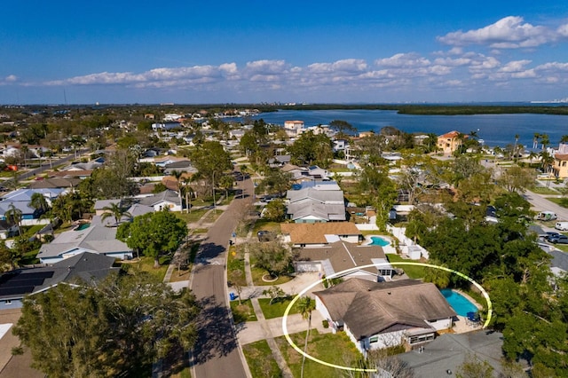 bird's eye view featuring a water view and a residential view