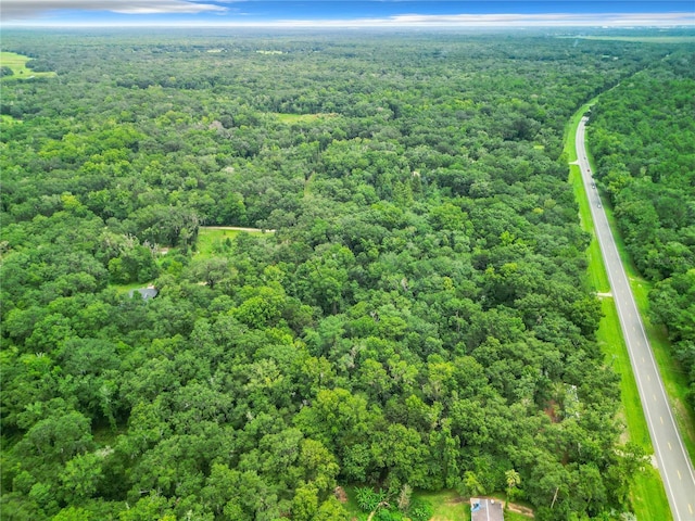 bird's eye view featuring a forest view