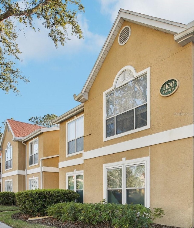 view of property exterior with stucco siding