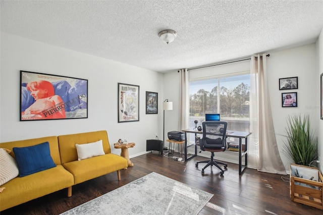 home office with dark wood finished floors, a textured ceiling, and baseboards