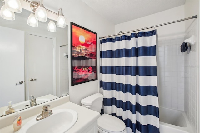 full bathroom featuring a textured ceiling, vanity, toilet, and shower / tub combo with curtain