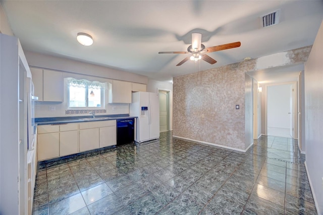 kitchen featuring black dishwasher, dark countertops, visible vents, a sink, and white fridge with ice dispenser