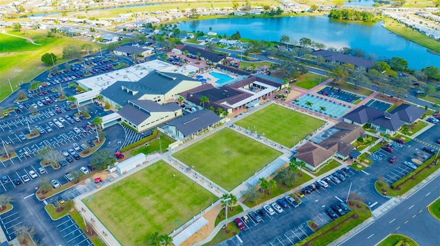 birds eye view of property with a water view