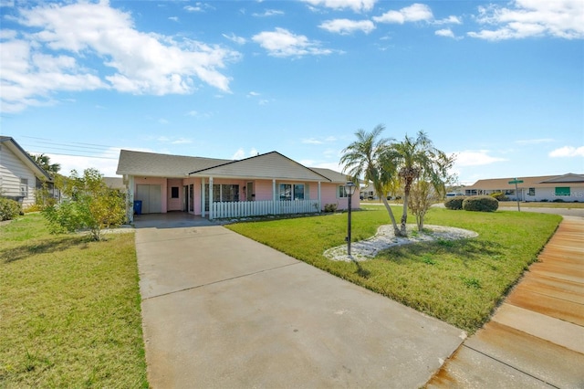 single story home with concrete driveway, a porch, and a front yard