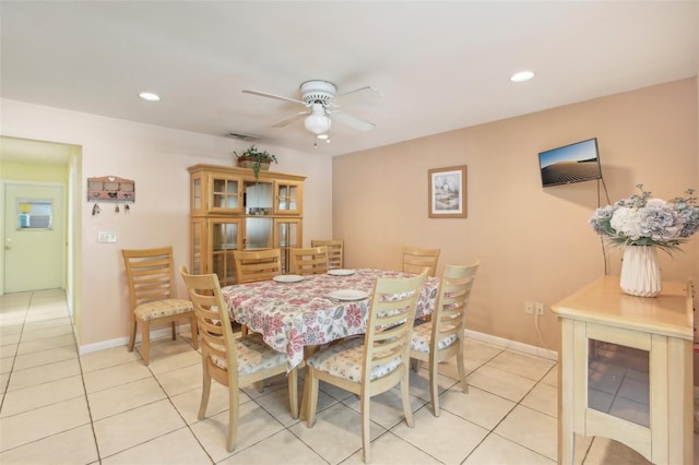 dining space featuring a ceiling fan, recessed lighting, light tile patterned flooring, and baseboards