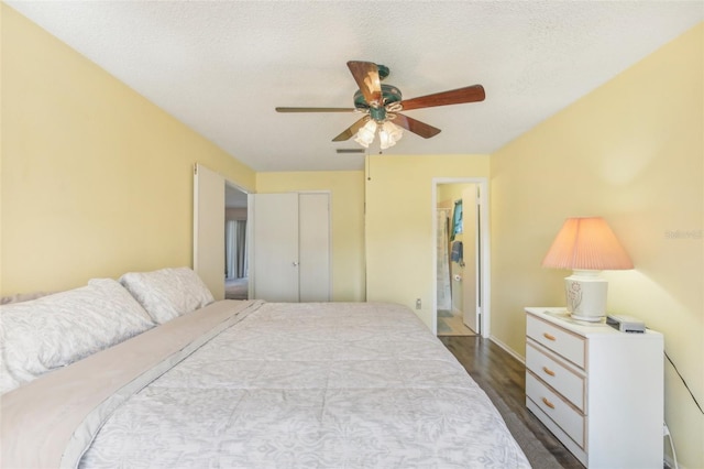 bedroom with baseboards, visible vents, a ceiling fan, wood finished floors, and a textured ceiling