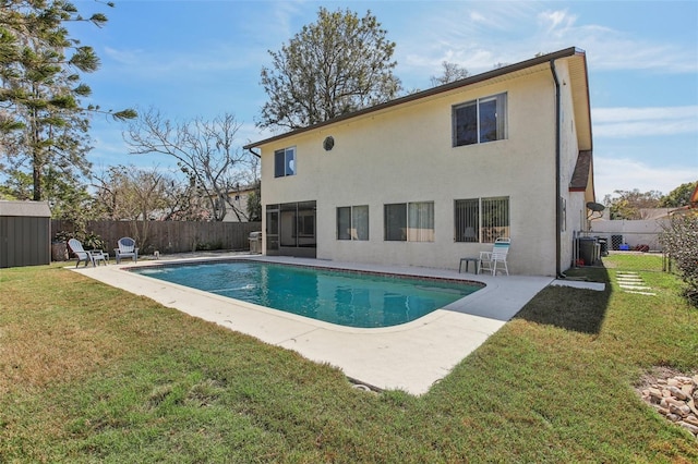 back of property featuring a patio, a fenced backyard, a yard, a fenced in pool, and stucco siding